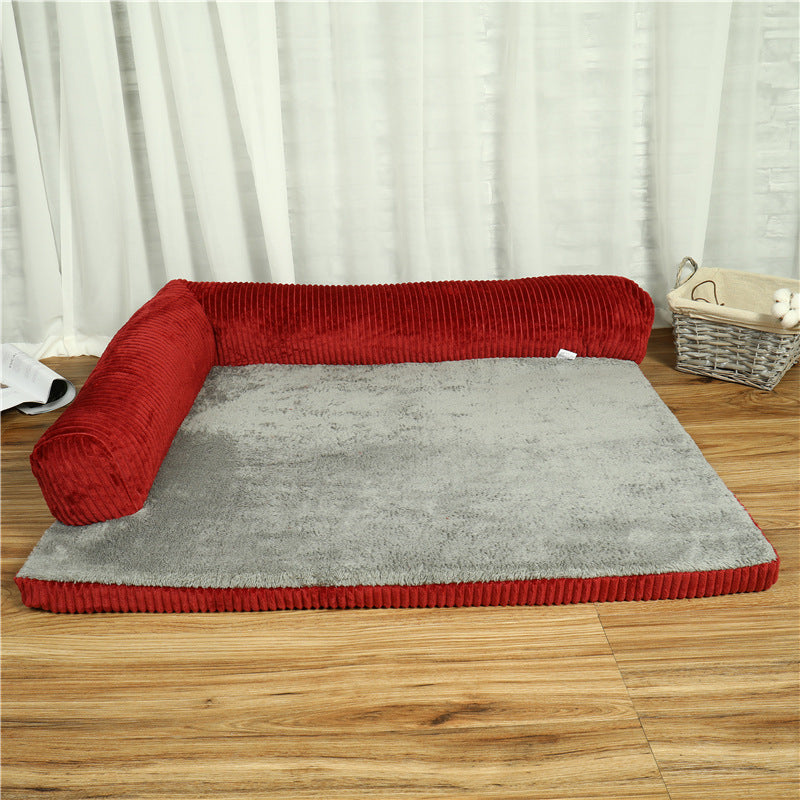 Red and gray corduroy pet dog bed with a soft cushioned surface and bolstered sides for comfort.